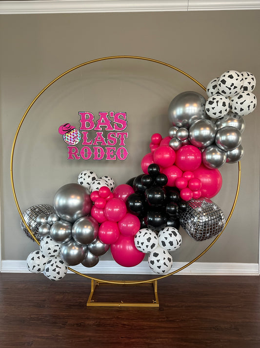 Circle Arch Rental with Diagonal Balloon Design and Cardstock Sign